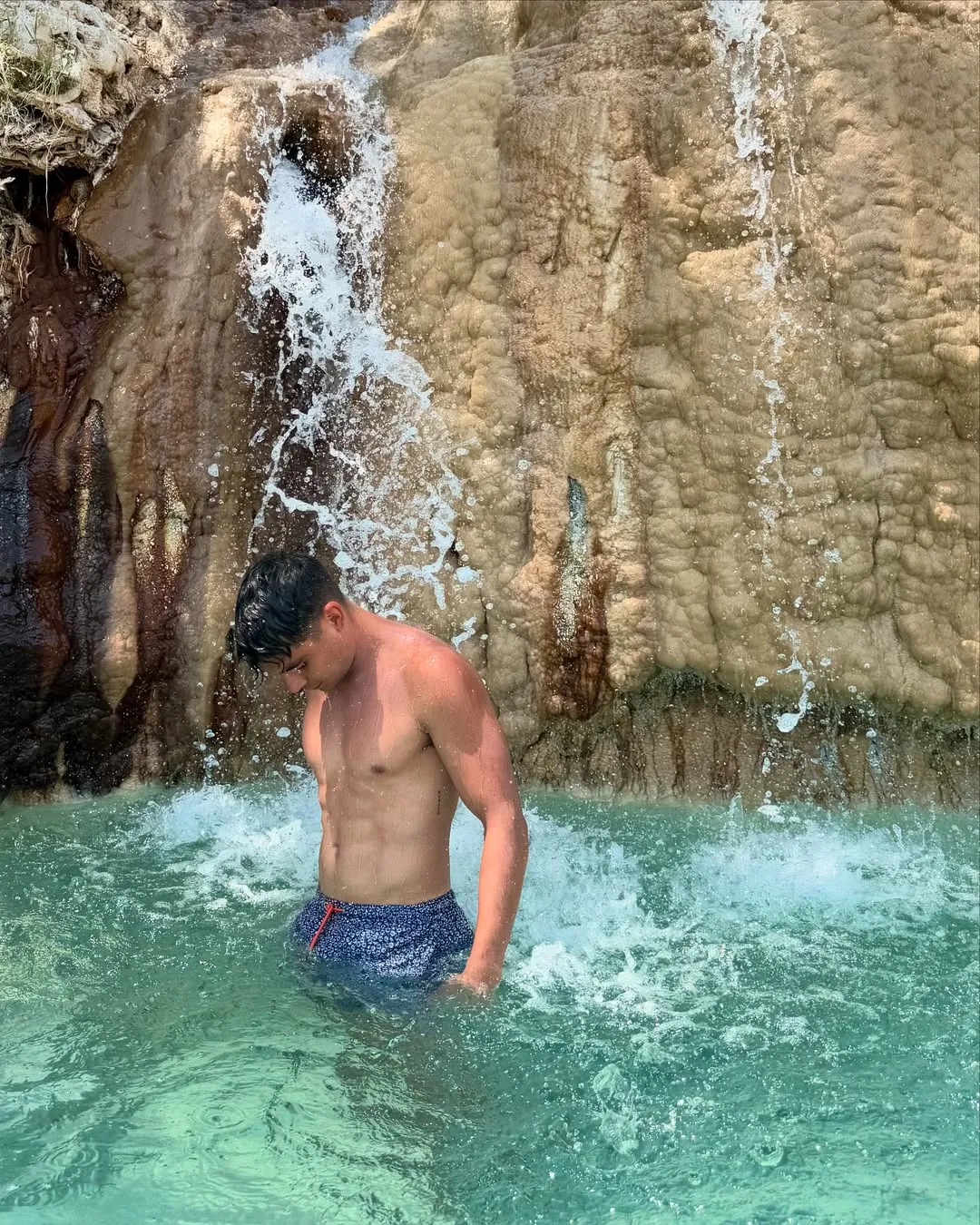Visitor enjoying the thermal waterfall at Tolantongo