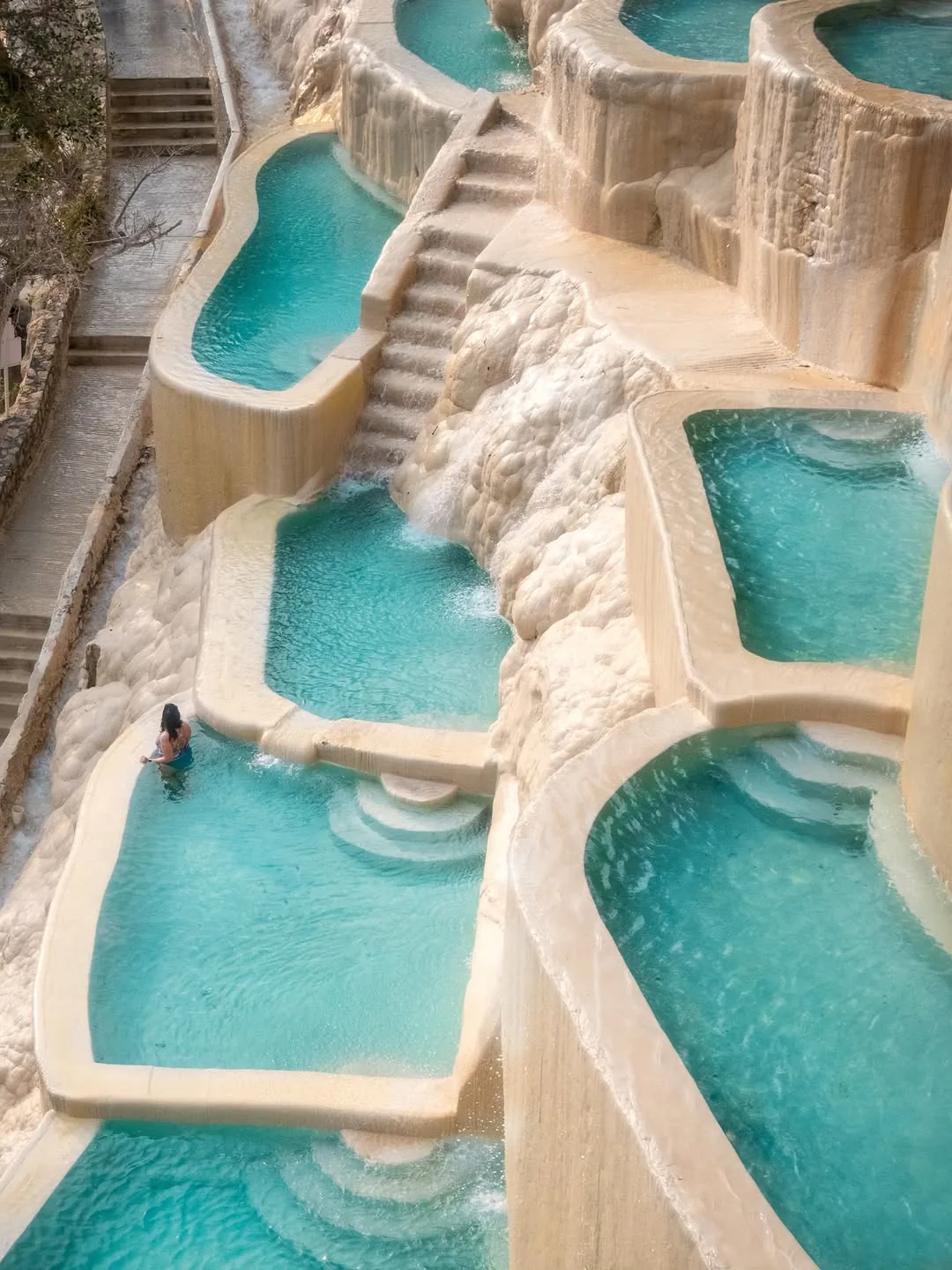 Steam rising from the terraced pools at Tolantongo with turquoise blue thermal water