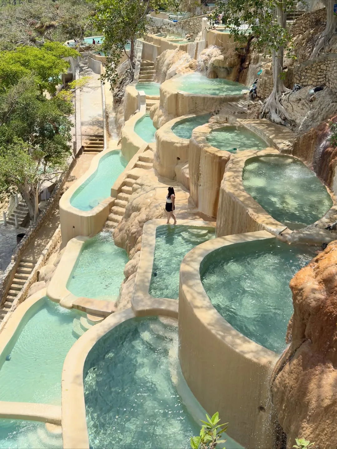 Woman at the high terraces of the thermal pools